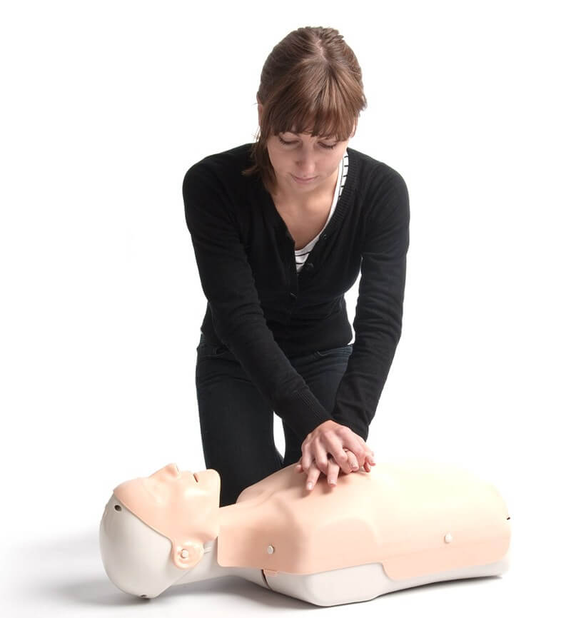 cpr-1 Woman performing CPR on a manikin